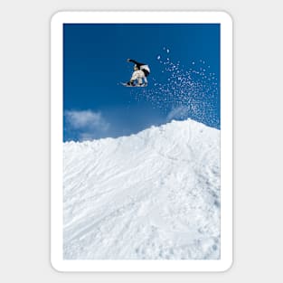 Snowboarder jumping against blue sky Magnet